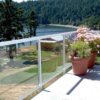Duradek Supreme Chip Granite Vinyl Decking and Glass Railing with White Posts